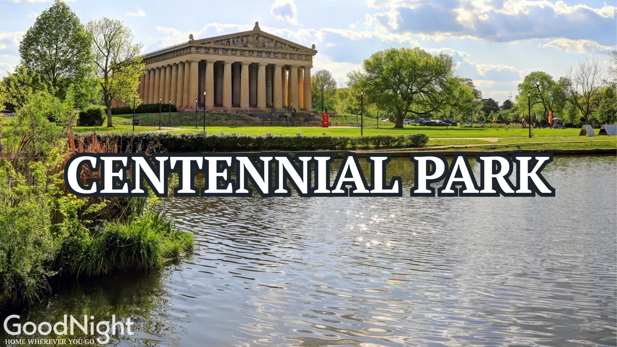 An exterior shot of the iconic Parthenon replica in Centennial Park, surrounded by lush greenery and reflecting on a serene body of water. The scene invites families to stroll, have picnics, and enjoy the outdoors.